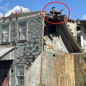 A Chair Teetering On A Crumbling Rooftop Becomes An Unlikely Tourist Attraction