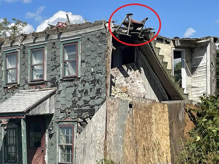 A Chair Teetering On A Crumbling Rooftop Becomes An Unlikely Tourist Attraction