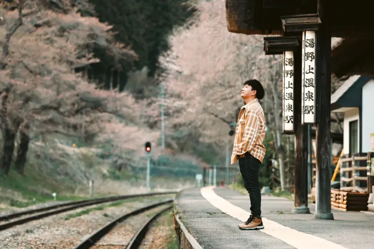 Mesmerized By The Timeless Charm Of A Train Station Immersed In Cherry Blossoms 2